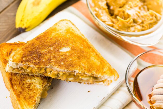 Homemade peanut butter and banana  sandwich on white bread.