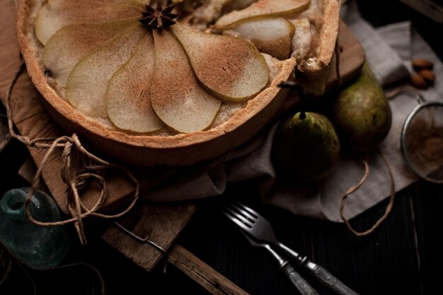 Homemade pear tart with cinnamon and sugar. Selective focus.