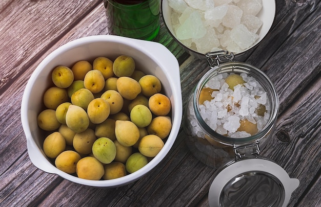 Homemade pickled plum with liquor and rock sugar in the glass bottle