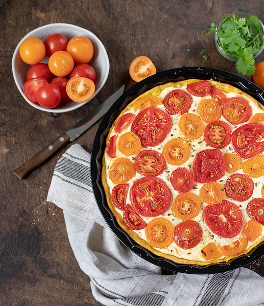 Homemade pie with tomatoes and ricotta, top view