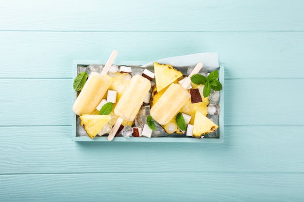 Homemade pineapple coconut popsicles