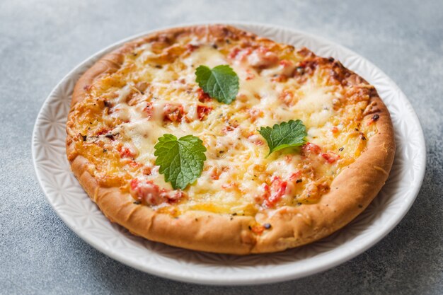 Homemade pizza tortilla with tomato and cheese 