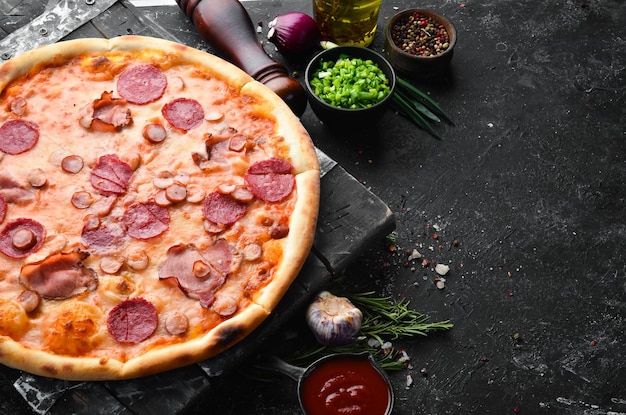 Homemade pizza with bacon and salami on the table Rustic style Top view