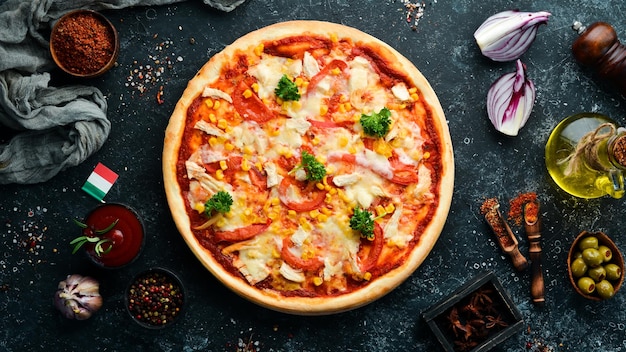 Homemade pizza with chicken tomatoes and corn Top view free space for your text Rustic style