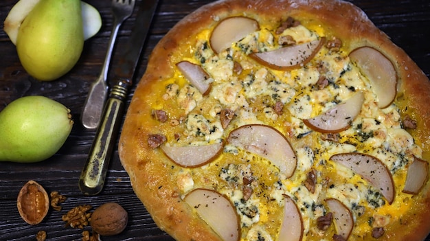 Homemade pizza with pear and walnuts Dorblu pizza