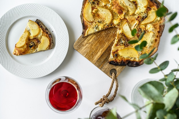 Homemade pizza with pears, nuts and blue cheese