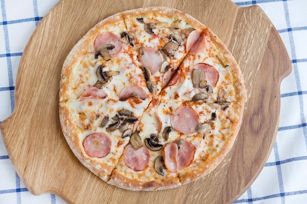 Homemade pizza with sausage on thick dough foodphoto for pizzeria menu catalog banner leaflet