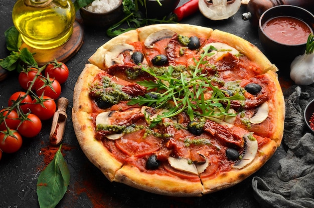 Homemade pizza with sundried tomatoes mushrooms and olives Italian cuisine Food delivery