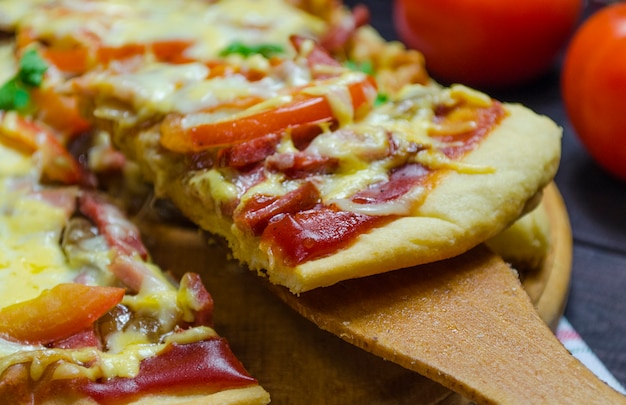 homemade pizza on a wooden tray