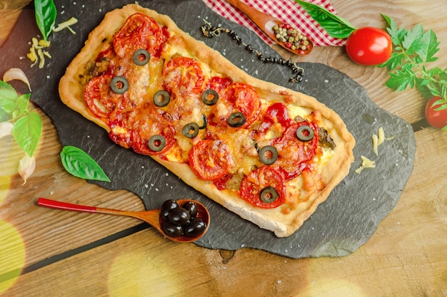 Homemade pizza on a wooden 