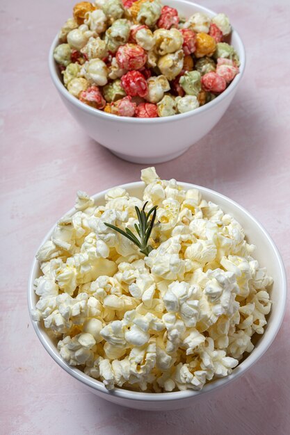 Homemade popcorn on colored table with high contrast light. Snack concept