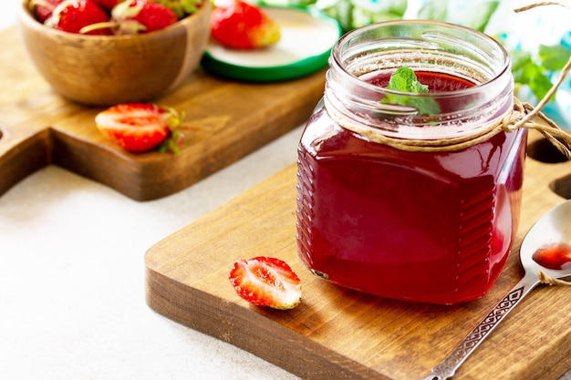 Homemade preservation Fresh strawberry berries and strawberry berry syrup