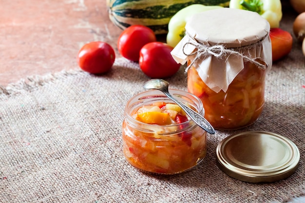 Homemade preserving. Zucchini and bell pepper salad in glass jar