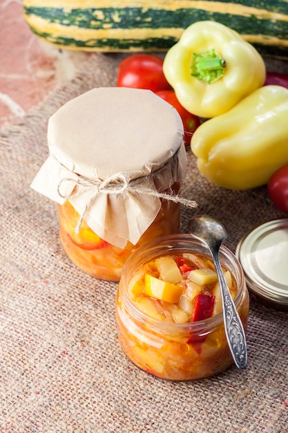 Homemade preserving. Zucchini and bell pepper salad in glass jar