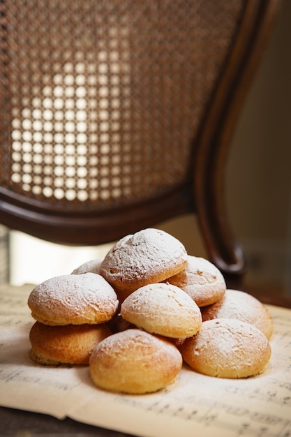 Homemade profiteroles on the music sheet with notes