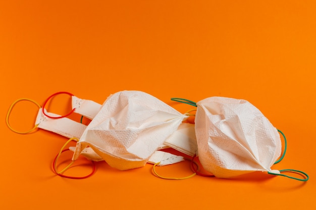 Homemade protective masks against the virus from paper towels and stationery