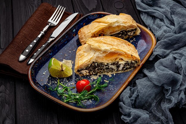 Homemade puff pastry pie with spinach and cheese