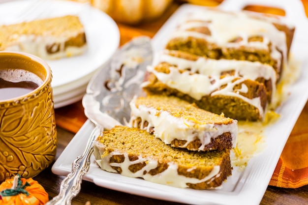 Homemade pumpkin bread with orange glazing on top.