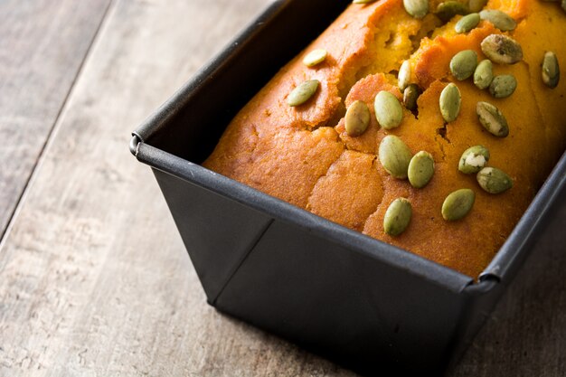 Homemade pumpkin bread on wooden table