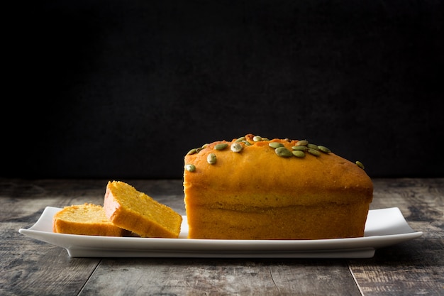 Homemade pumpkin bread on wooden table