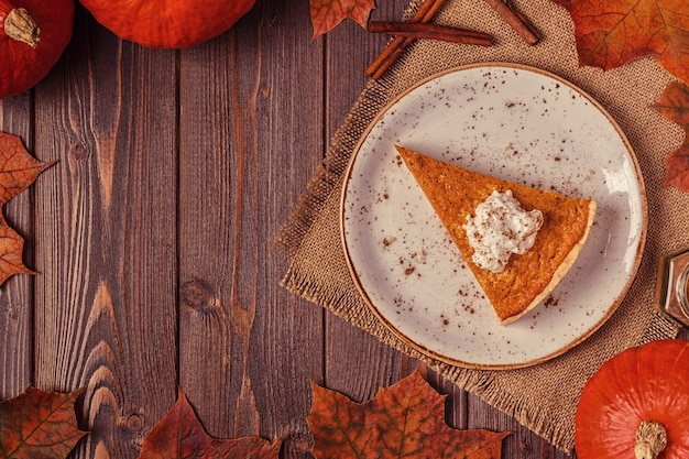 Homemade pumpkin pie on a white plate