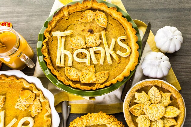 Homemade pumpkin pies with autumn stamped leafs