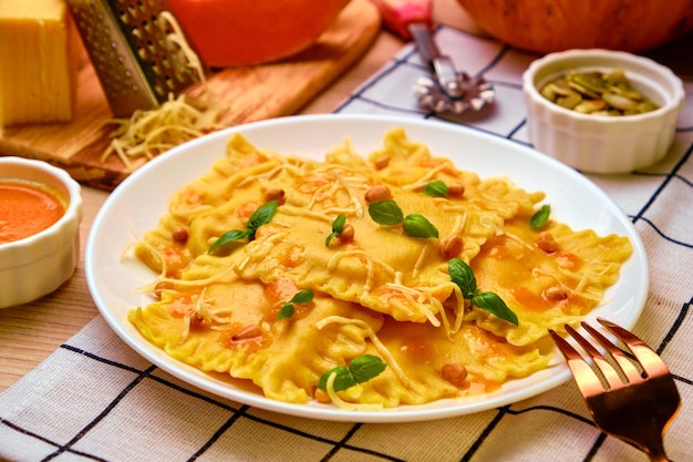 Homemade Pumpkin Ravioli with ricotta cheese served basil