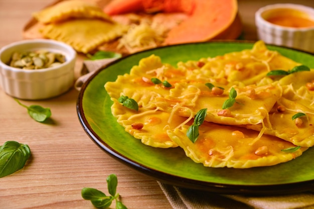 Homemade Pumpkin Ravioli with ricotta cheese served basil