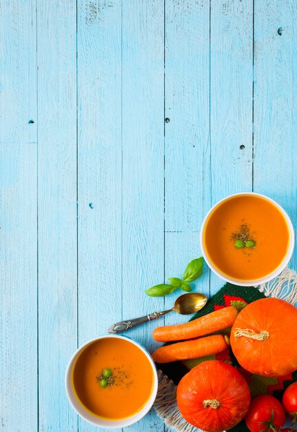 Homemade Pumpkin Soup on rustic on wood