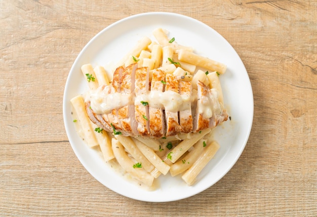 homemade quadrotto penne pasta white creamy sauce with grilled chicken