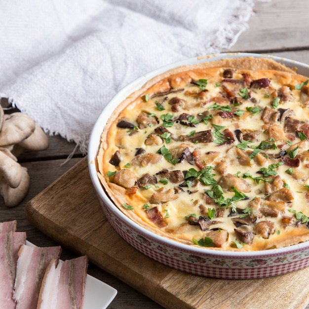 Homemade quiche lorraine with chicken, mushrooms, cheese and bacon. 