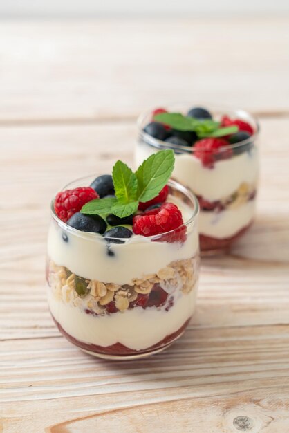 Homemade raspberry and blueberry with yogurt and granola - healthy food style