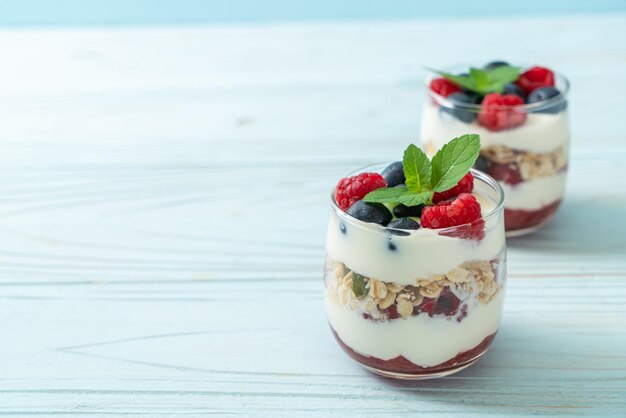 homemade raspberry and blueberry with yogurt and granola - healthy food style