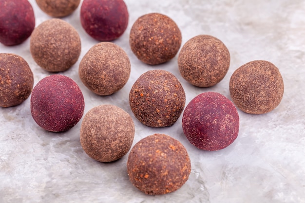 Homemade raw vegan cacao energy balls lie in row