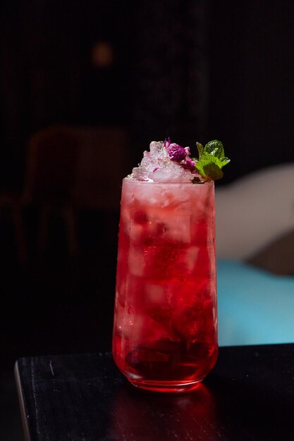 homemade red currant lemonade in a mason jar on wooden table