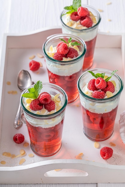 Homemade red jelly made of berries and whipped cream