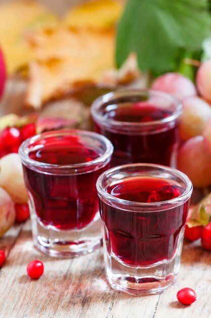 Homemade red wine glasses on the autumn background selective focus