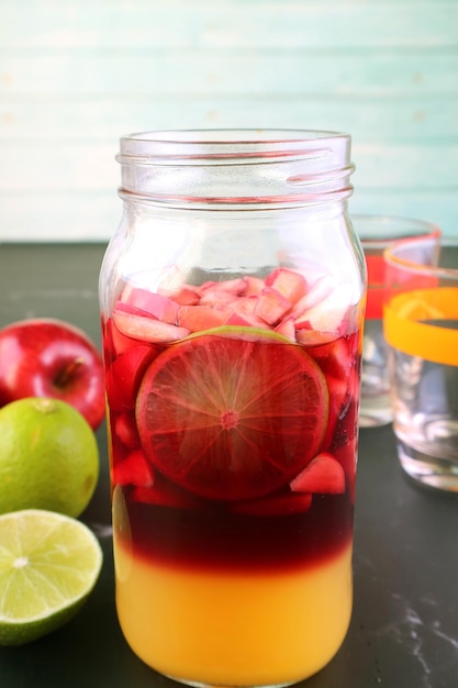 Homemade Red Wine Sangria in a Grass Bottle before Mixing