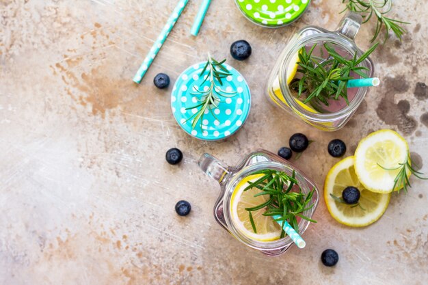 Homemade refreshing drink with blueberries lemon and rosemary The concept of proper nutrition