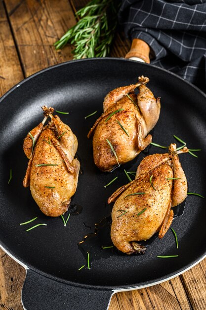 Homemade roast quail in a pan