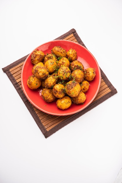 Homemade Roasted Bombay potatoes Pan fried little baby potatoes or aloo with jeera seeds and coriander in bowl