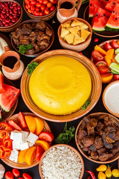 Homemade Romanian Food with polenta, meat, cheese and vegetables