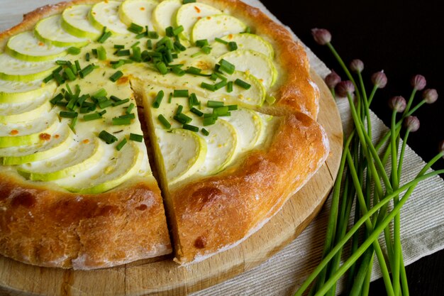 Homemade rustic pie with zucchini and onions.