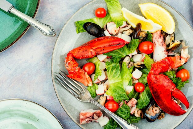 Homemade salad of shrimp mussels lobster and vegetables