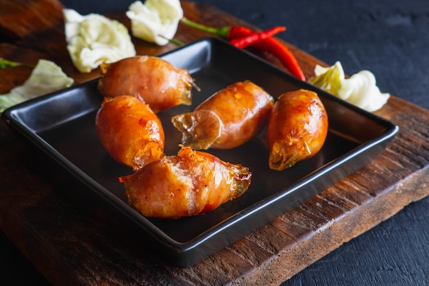 Homemade sausages fried in a frying pan