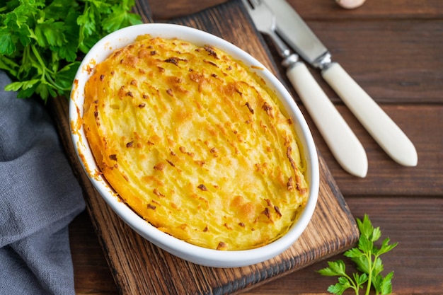 Homemade Shepherds Pie in the casserole dish British dish with minced meat and mashed potatoes