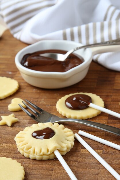 Homemade shortbread cookies pops with chocolate, process of baking