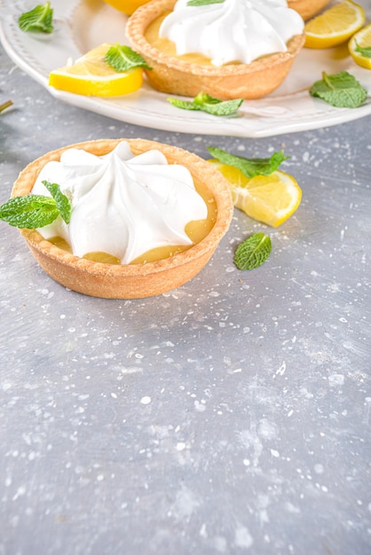 Homemade shortbread mini tart cakes with lemon curd and whipped cream 