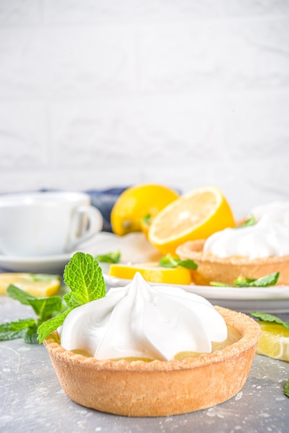 Homemade shortbread mini tart cakes with lemon curd and whipped cream 