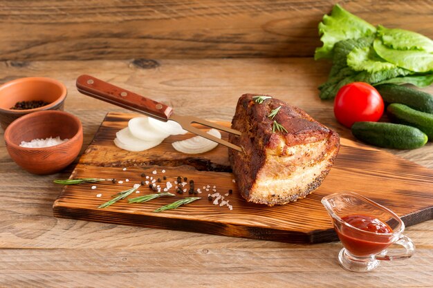 Homemade Smoked Barbecue Beef Brisket on wooden cutting board before cutting.